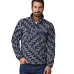 A man wearing teh Patagonia Men's Synch Snap-T Pull Over New Navy