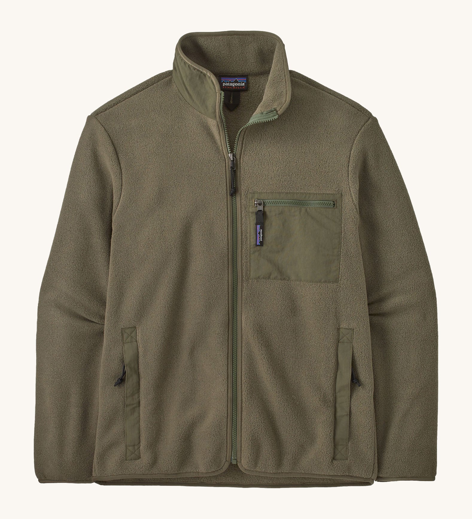 Patagonia Men's Synchilla® Fleece Jacket in Basin Green, a solid khaki green full zip fleece jacket. Made from Synchilla® 100% recycled fleece. Features a stand up collar handwarmer pockets and a left chest zippered patch pocket. 