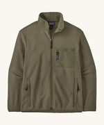 Patagonia Men's Synchilla® Fleece Jacket in Basin Green, a solid khaki green full zip fleece jacket. Made from Synchilla® 100% recycled fleece. Features a stand up collar handwarmer pockets and a left chest zippered patch pocket. 