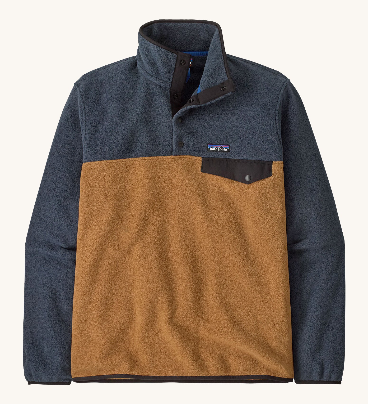 Patagonia mens synchilla jacket. A lightweight fleece in dark blue and brown colour. Features a chest pocket, logo patch stitched above and a 1/4 length popper fastener.
