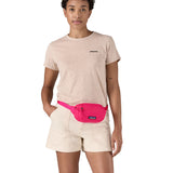Patagonia Terravia Mini Hip Pack in a  luminous pink colour worn by an adult
