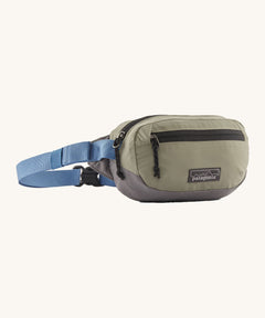 Patagonia Terravia Mini Hip Pack in a river rock colour on a cream background