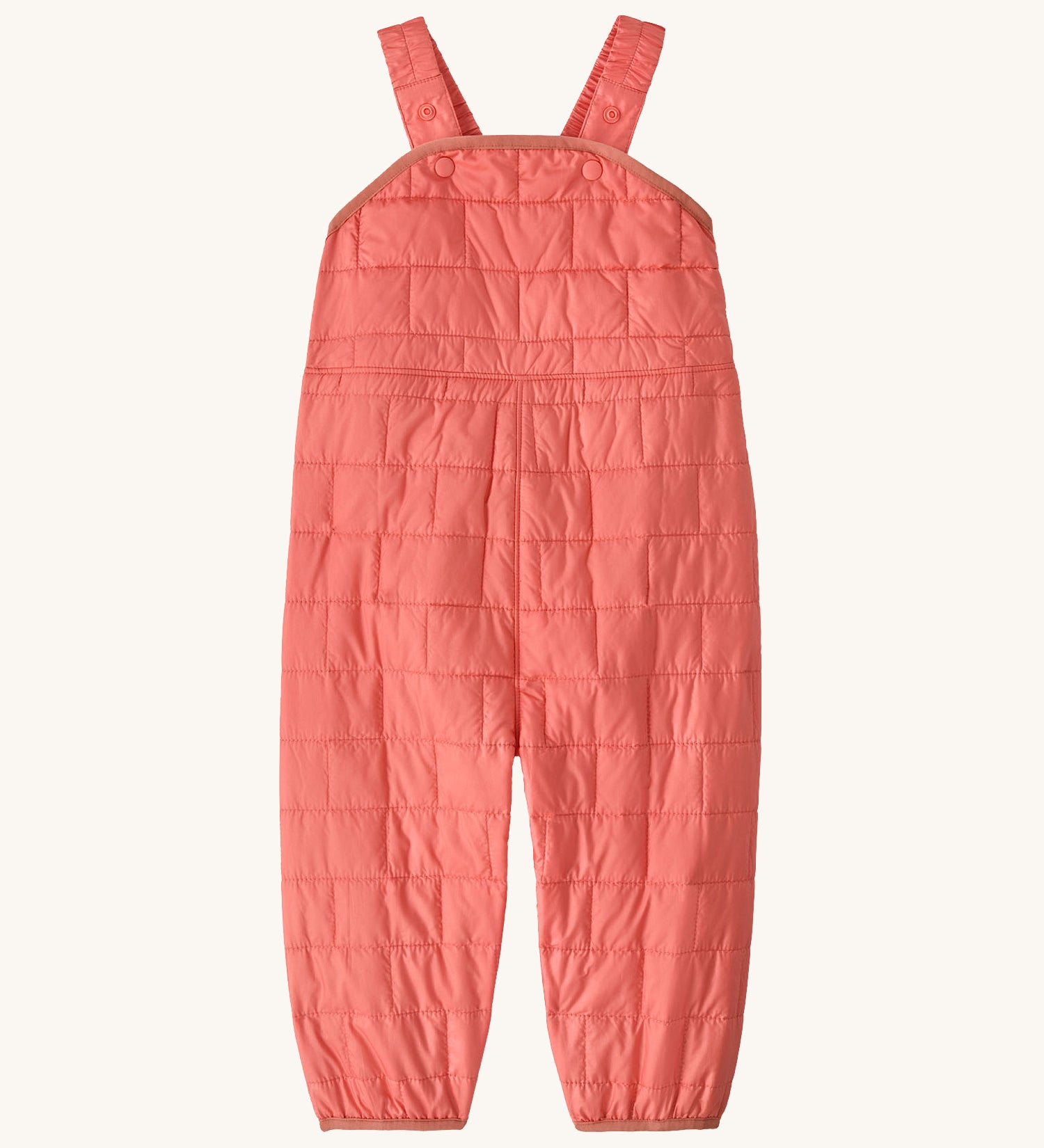 Patagonia kids nano puffer winter overalls in pink. Features popper fasteners on each shoulder strap for size adjustment. 