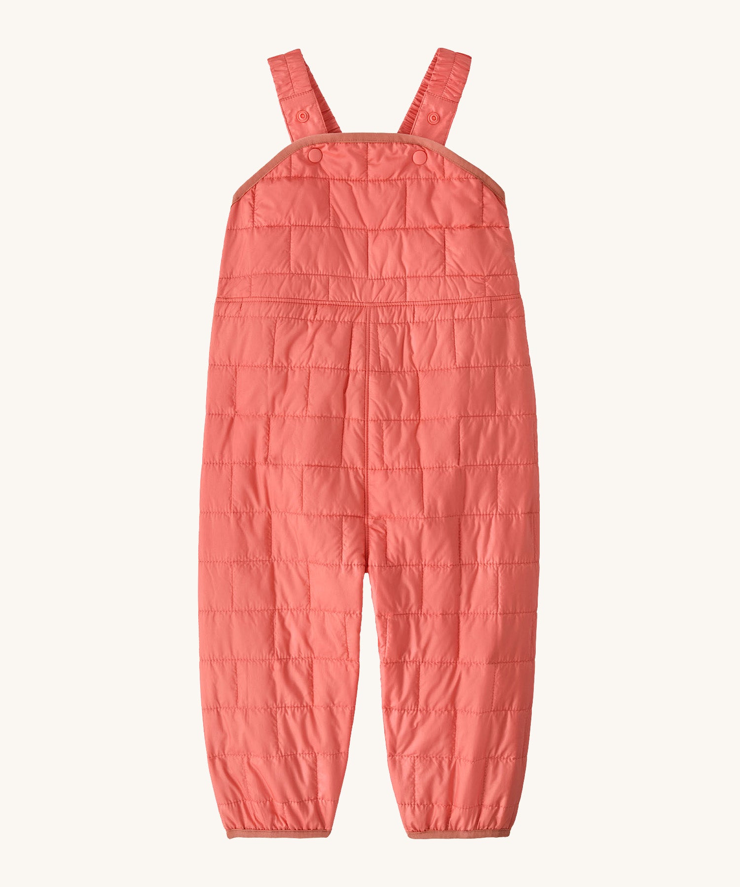Patagonia kids nano puffer winter overalls in pink. Features popper fasteners on each shoulder strap for size adjustment. 