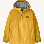 The Patagonia Little Kids Torrentshell 3L Waterproof Jacket in a yellow colour on a cream background.