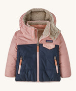 Patagonia little kids tribbles hoody. A reversible coat showing a pink and navy hooded coat and natural fleece inner for warmth. Features a small chest pocket with popper fastening and 2 side zip pockets