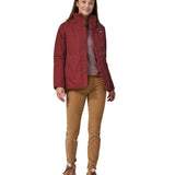 A woman wearing the Patagonia off slope womens carmine red jacket with a brand logo.