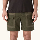 Patagonia Men's Outdoor Everyday Shorts in Pine Needle Green being worn.