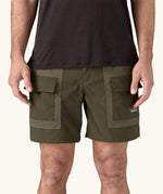 Patagonia Men's Outdoor Everyday Shorts in Pine Needle Green being worn.