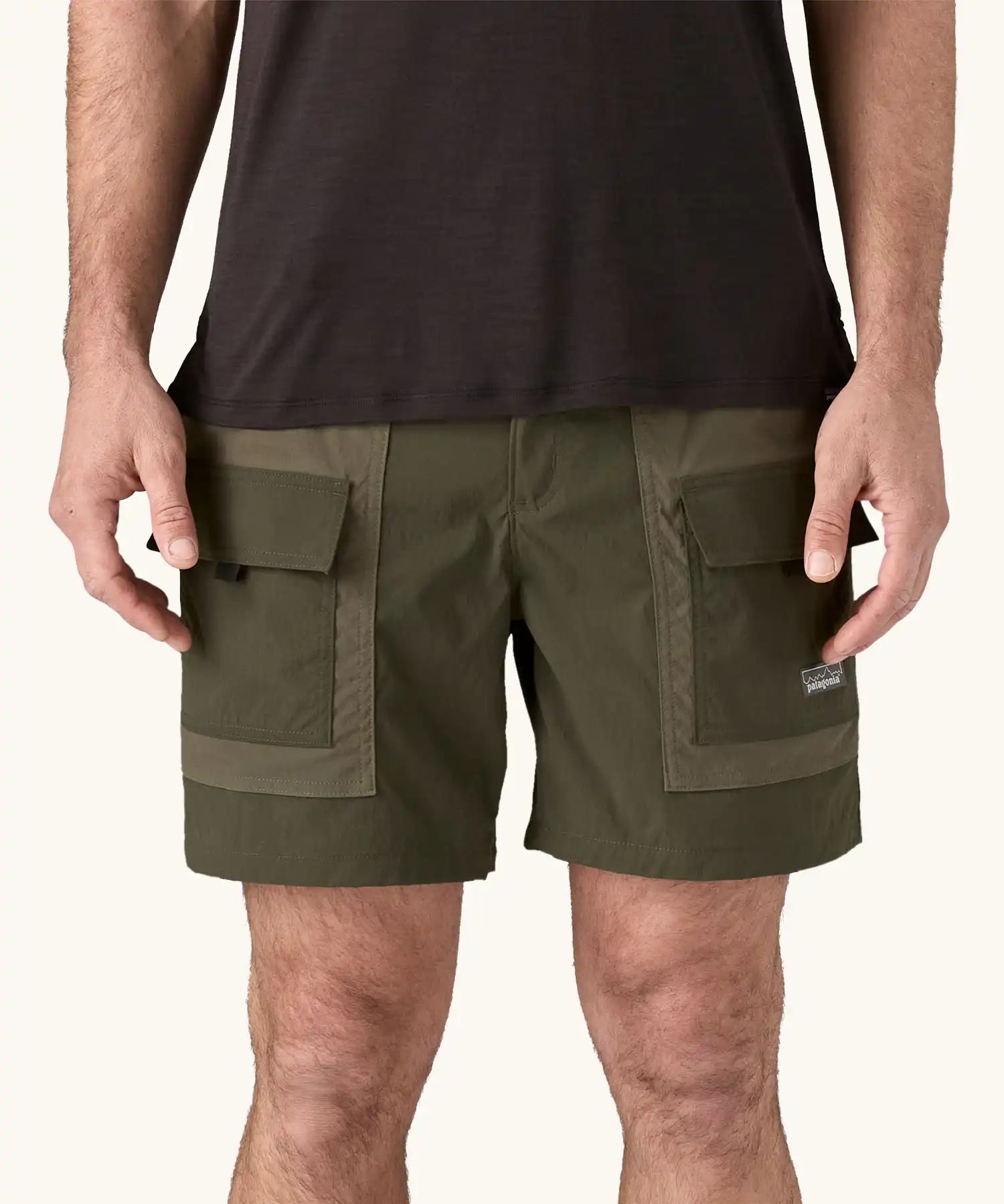 Patagonia Men's Outdoor Everyday Shorts in Pine Needle Green being worn.