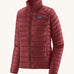 Patagonia women's down sweater jacket in oxide red colour on a cream background.