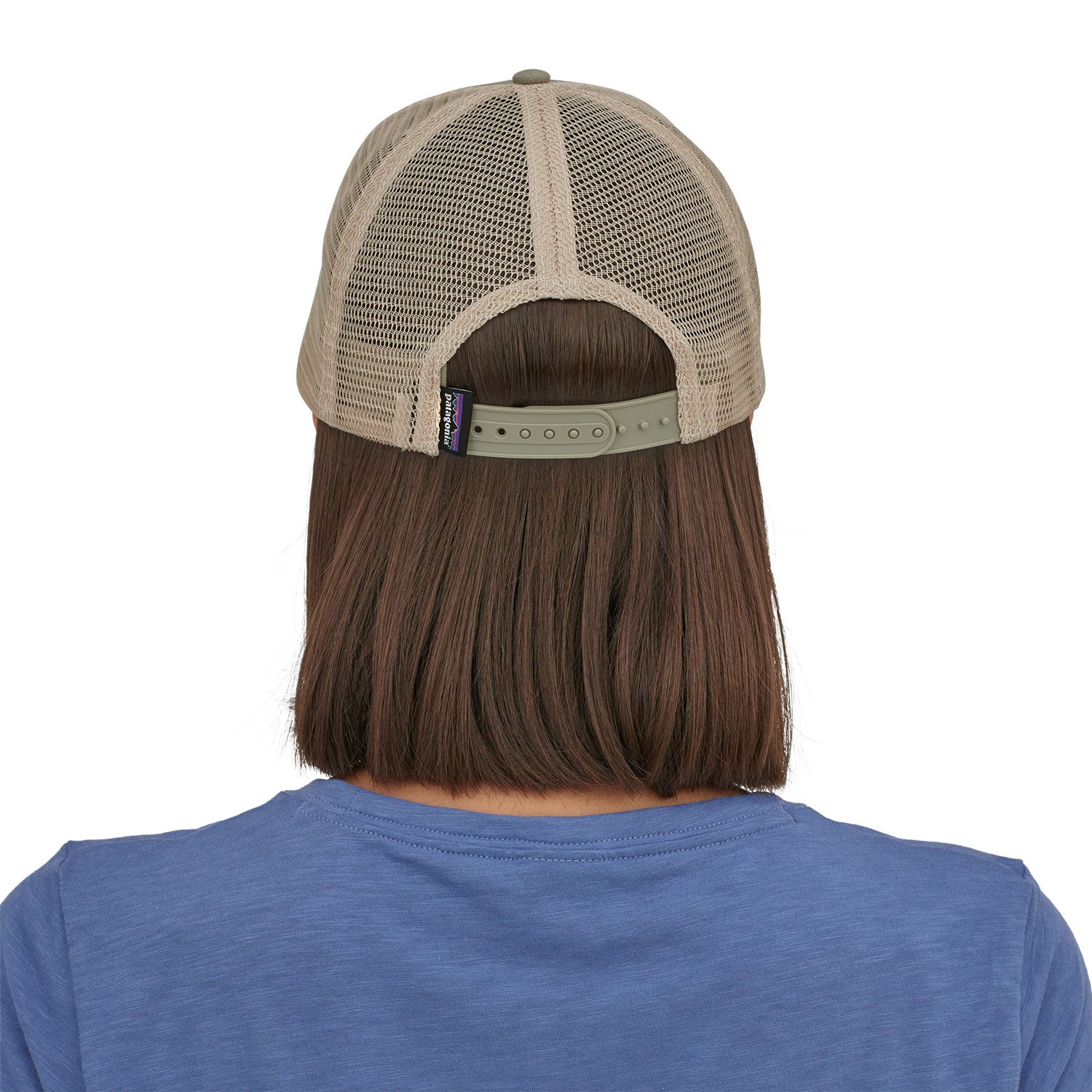 view of the back of a person wearing a Patagonia P-6 Logo LoPro Trucker Hat in a stone beige colour way