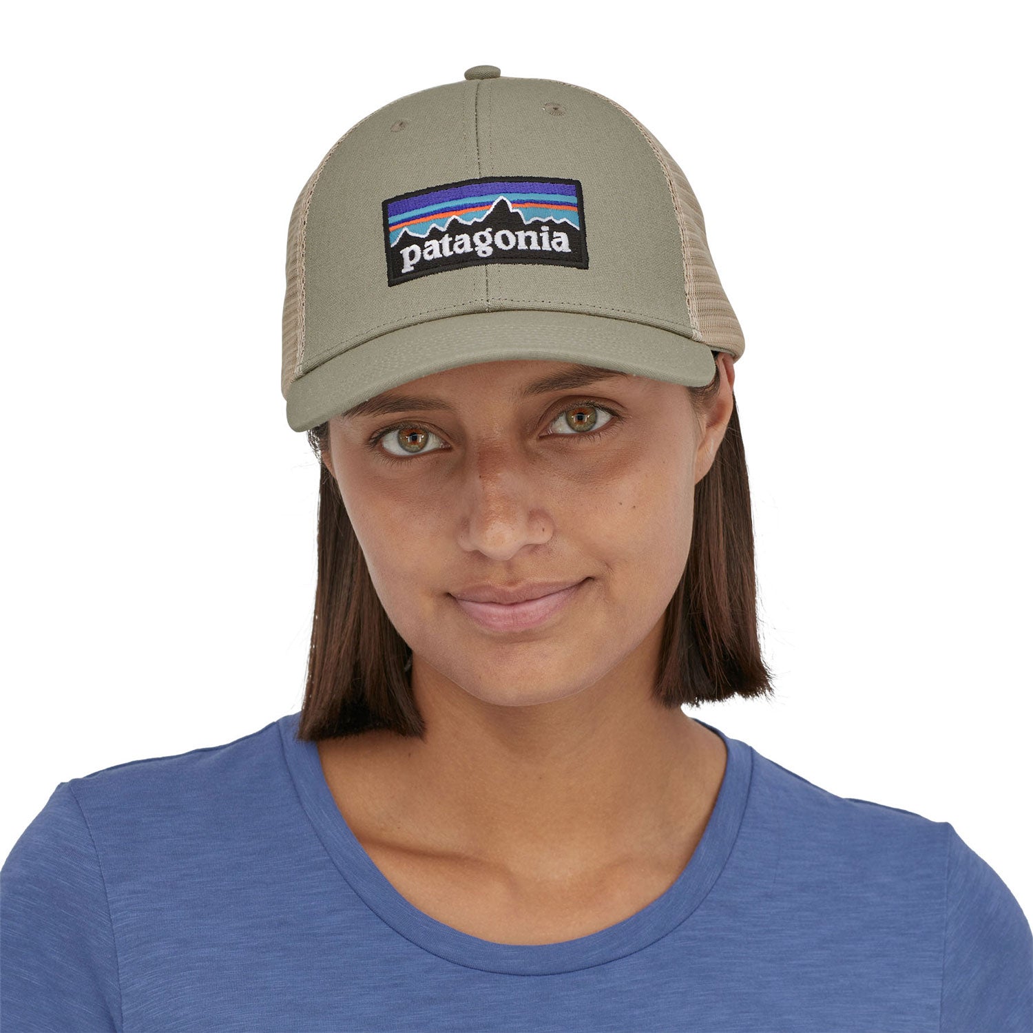 view of the front of a person wearing a Patagonia P-6 Logo LoPro Trucker Hat in a stone beige colour way
