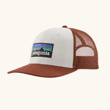 Patagonia P-6 logo trucker hat in  white rusty red. Made with organic cotton with a polyester mesh back.