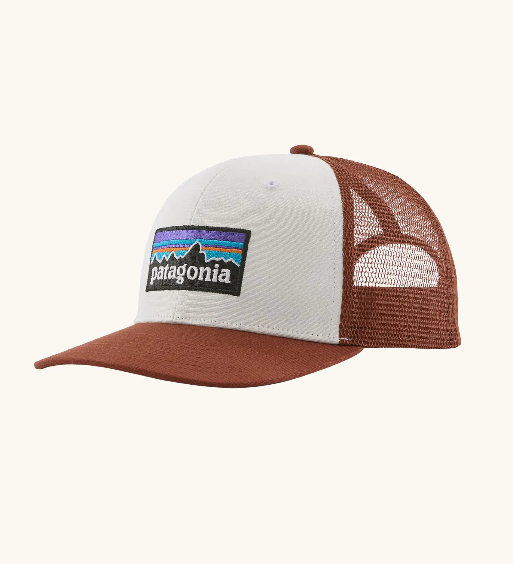 Patagonia P-6 logo trucker hat in  white rusty red. Made with organic cotton with a polyester mesh back.