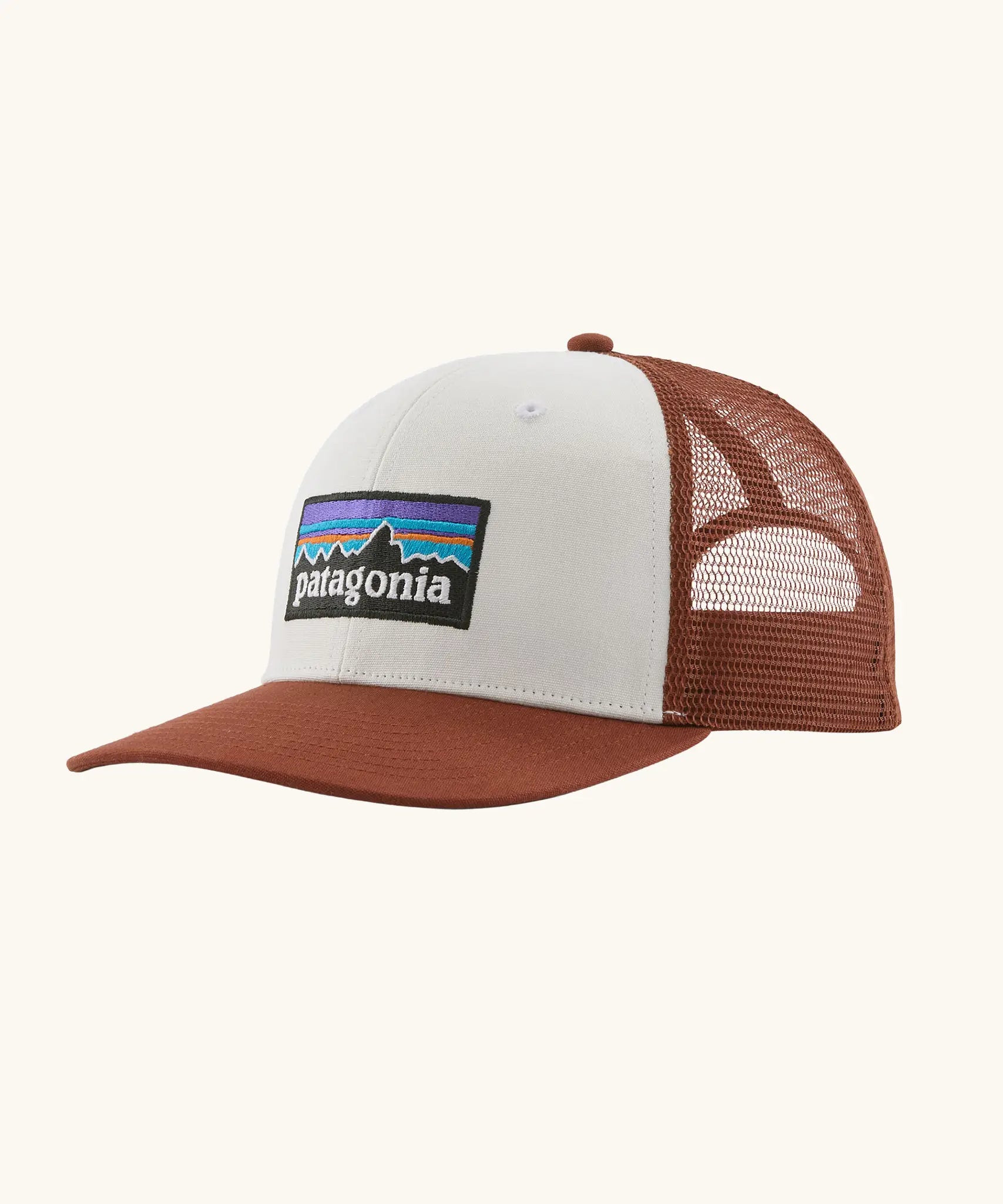 Patagonia P-6 logo trucker hat in  white rusty red. Made with organic cotton with a polyester mesh back.