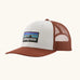 Patagonia P-6 logo trucker hat in  white rusty red. Made with organic cotton with a polyester mesh back.