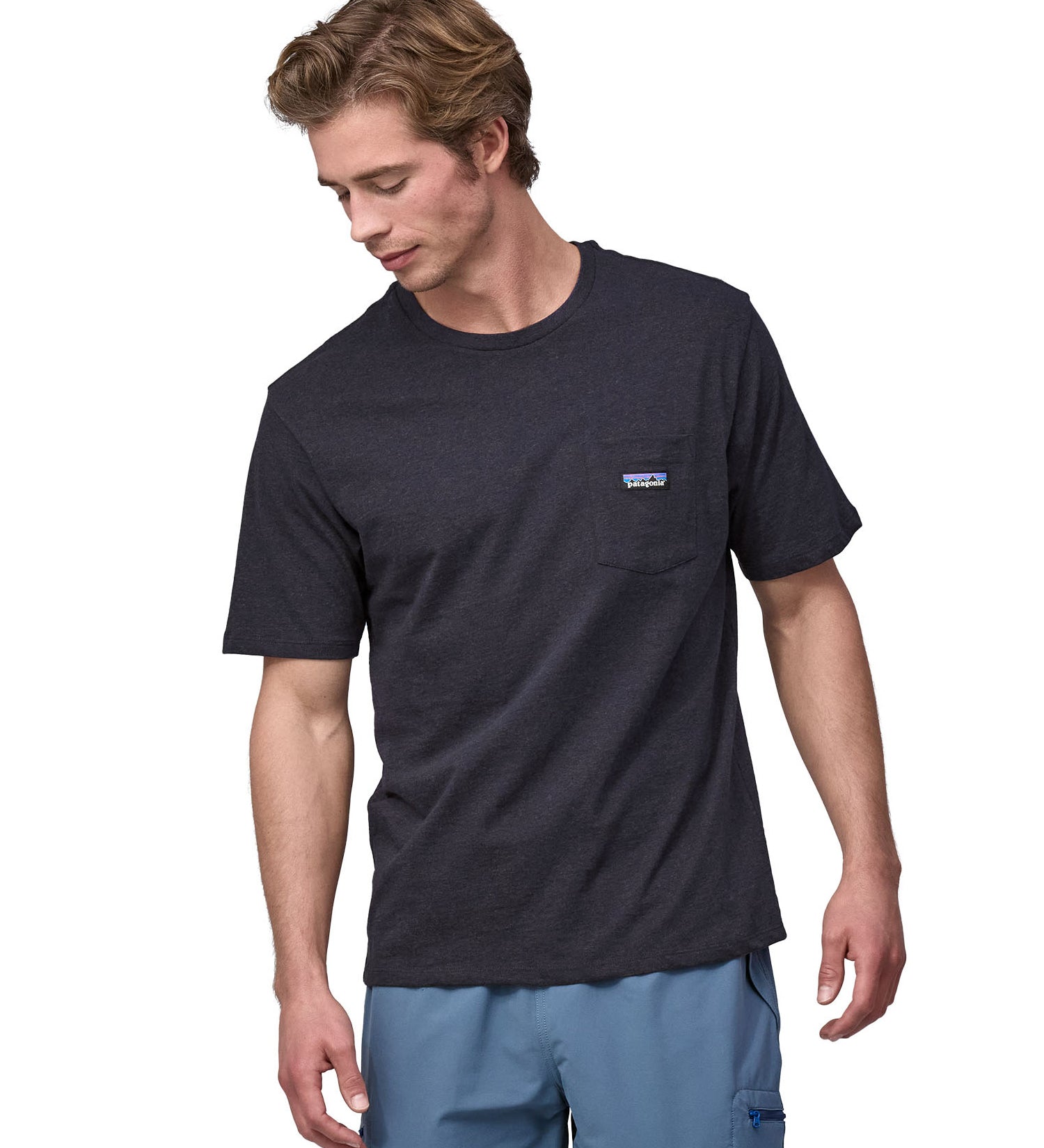 Patagonia men's short sleeve top with a pocket on the front in a black worn by a man