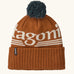 Patagonia powder town recycled knit bobble hat beanie with a hut tripper logo in cinnamon brown. 