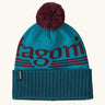 Patagonia powder town recycled knit bobble hat beanie with a hut tripper logo in mako blue. 