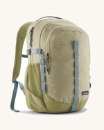 Patagonia refugio 26L back pack in weathered stone with grey straps and buckles. 