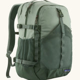 Patagonia refugio day pack 30L backpack in a two tone cover green. Large zipped compartments, side bottle holders and equipment straps.
