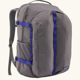 Patagonia refugio day pack 32 litre backpack in may grey with contrasting blue equipment straps.