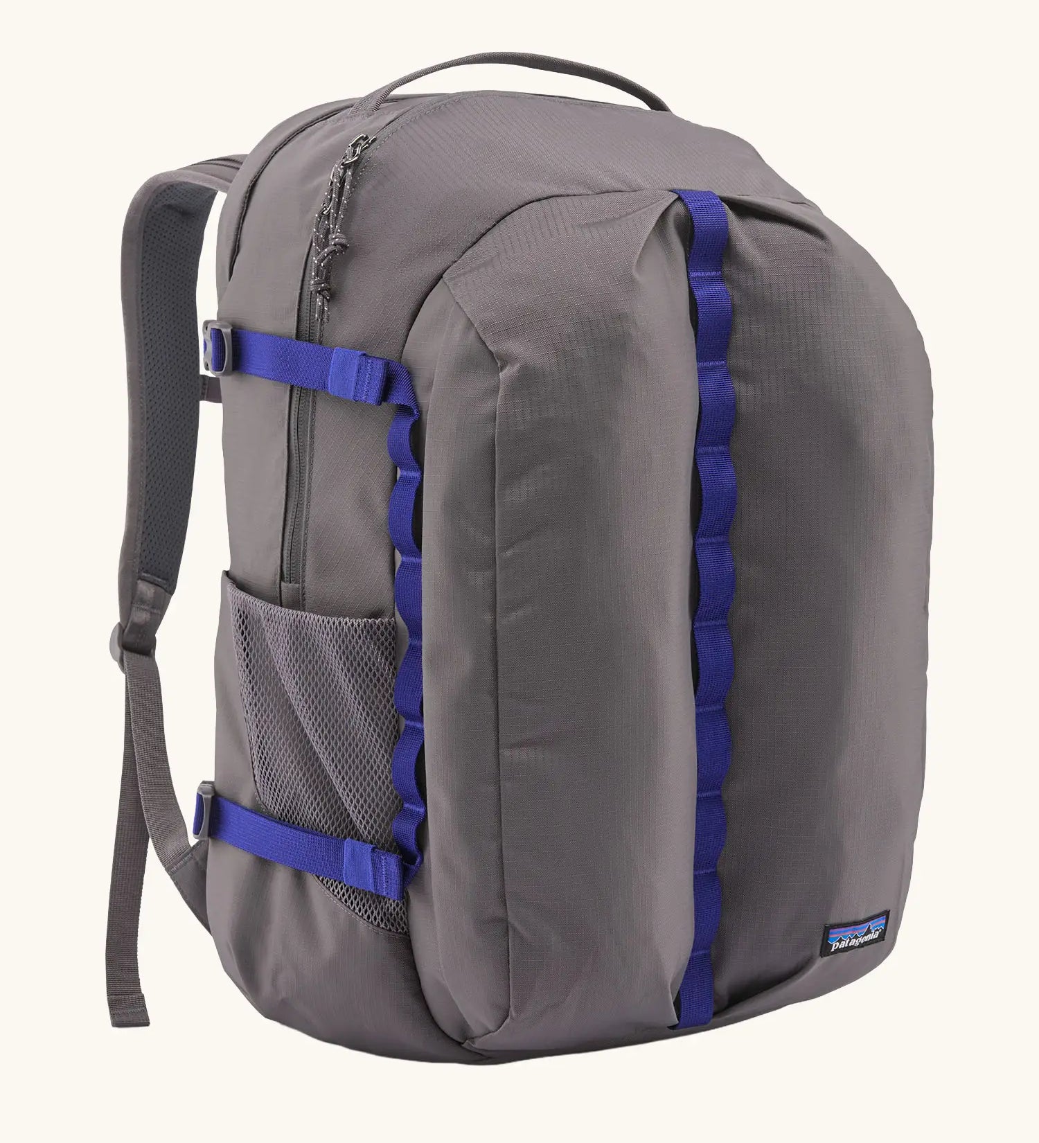 Patagonia refugio day pack 32 litre backpack in may grey with contrasting blue equipment straps.