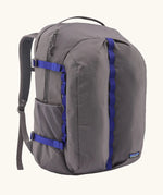 Patagonia refugio day pack 32 litre backpack in may grey with contrasting blue equipment straps.
