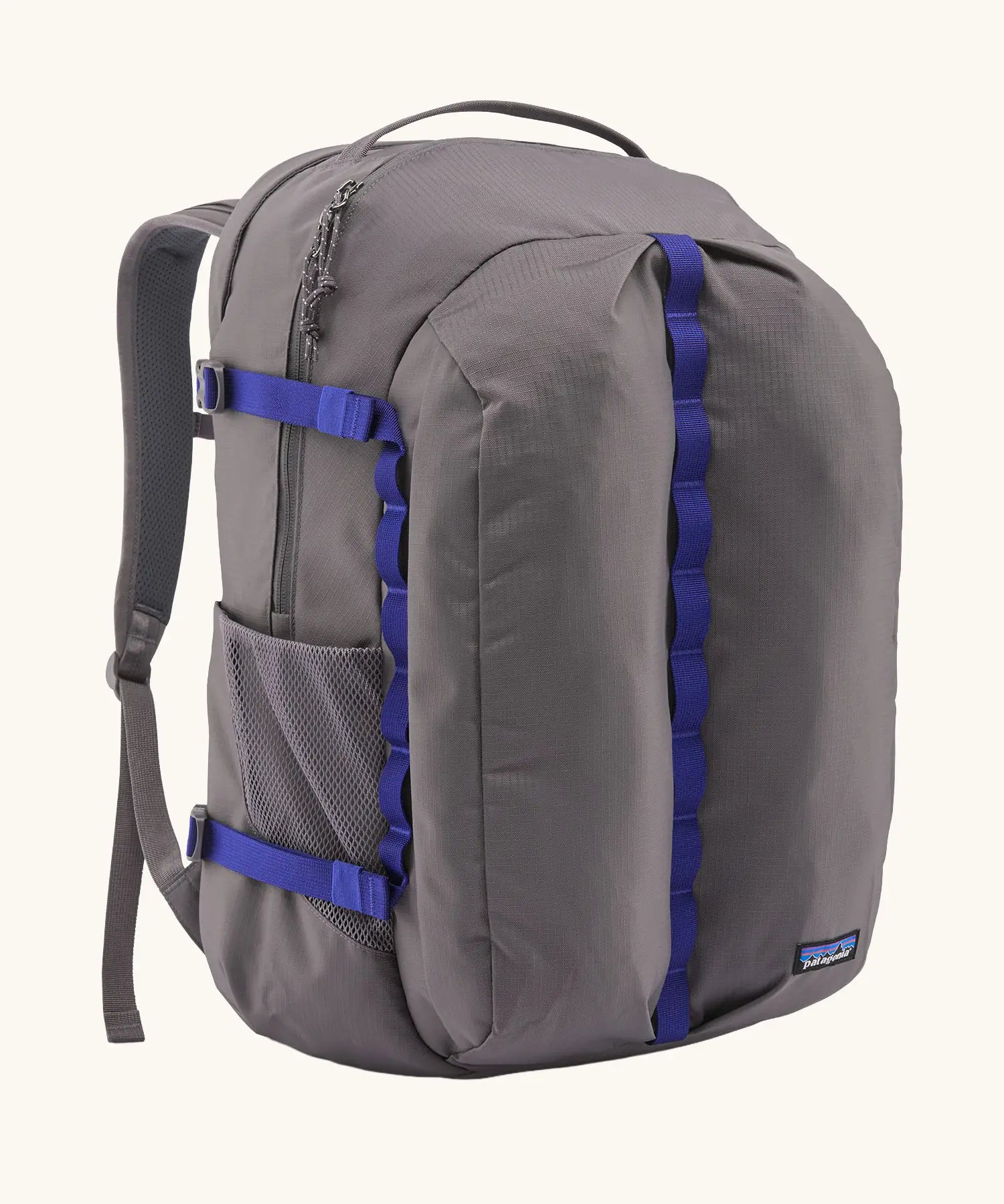 Patagonia refugio day pack 32 litre backpack in may grey with contrasting blue equipment straps.