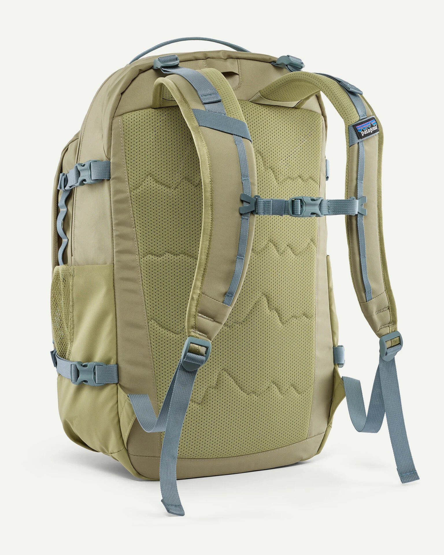 Back of the Patagonia refugio 32L daypack in weathered stone light green and blue trim. Padded straps and quick release buckle chest strap.