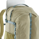 Laptop placed in the pocket at the back of the Patagonia refugio 32L day pack backpack in weathered stone light green and blue trim.