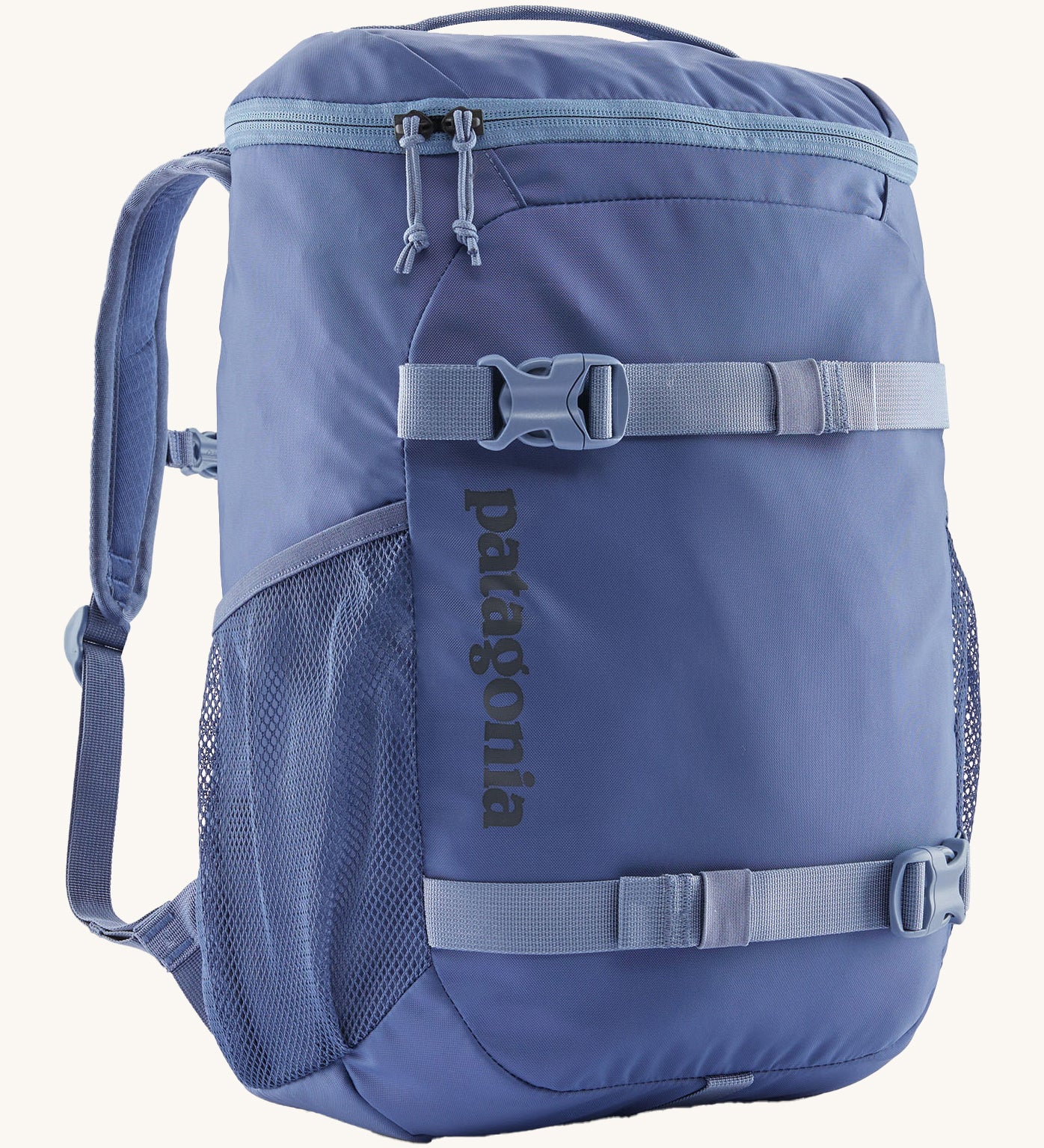 Patagonia refugito 18 litres daypack in sunken blue. A dark blue backpack and features 2 side mesh pockets, buckle fasteners on the front to keep it secure and a zip on the top for easy access.