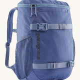 Patagonia refugito 18 litres daypack in sunken blue. A dark blue backpack and features 2 side mesh pockets, buckle fasteners on the front to keep it secure and a zip on the top for easy access.