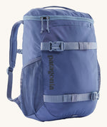 Patagonia refugito 18 litres daypack in sunken blue. A dark blue backpack and features 2 side mesh pockets, buckle fasteners on the front to keep it secure and a zip on the top for easy access.