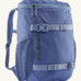 Patagonia refugito 18 litres daypack in sunken blue. A dark blue backpack and features 2 side mesh pockets, buckle fasteners on the front to keep it secure and a zip on the top for easy access.