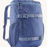Patagonia refugito 18 litres daypack in sunken blue. A dark blue backpack and features 2 side mesh pockets, buckle fasteners on the front to keep it secure and a zip on the top for easy access.
