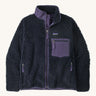 Patagonia womens retro-x jacket. A thick navy fleece and features a dark purple full length zip, chest pocket, side pockets and a logo patch stitched on the left chest.