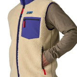 close up showing man putting hand in pocket of the vest fleece
