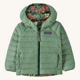 Patagonia little kids down hooded jacket in cascade green/see saw owl. A light green warm reversible jacket with a owl design on the reversible side. Features a a full length zip and 2 side pockets.