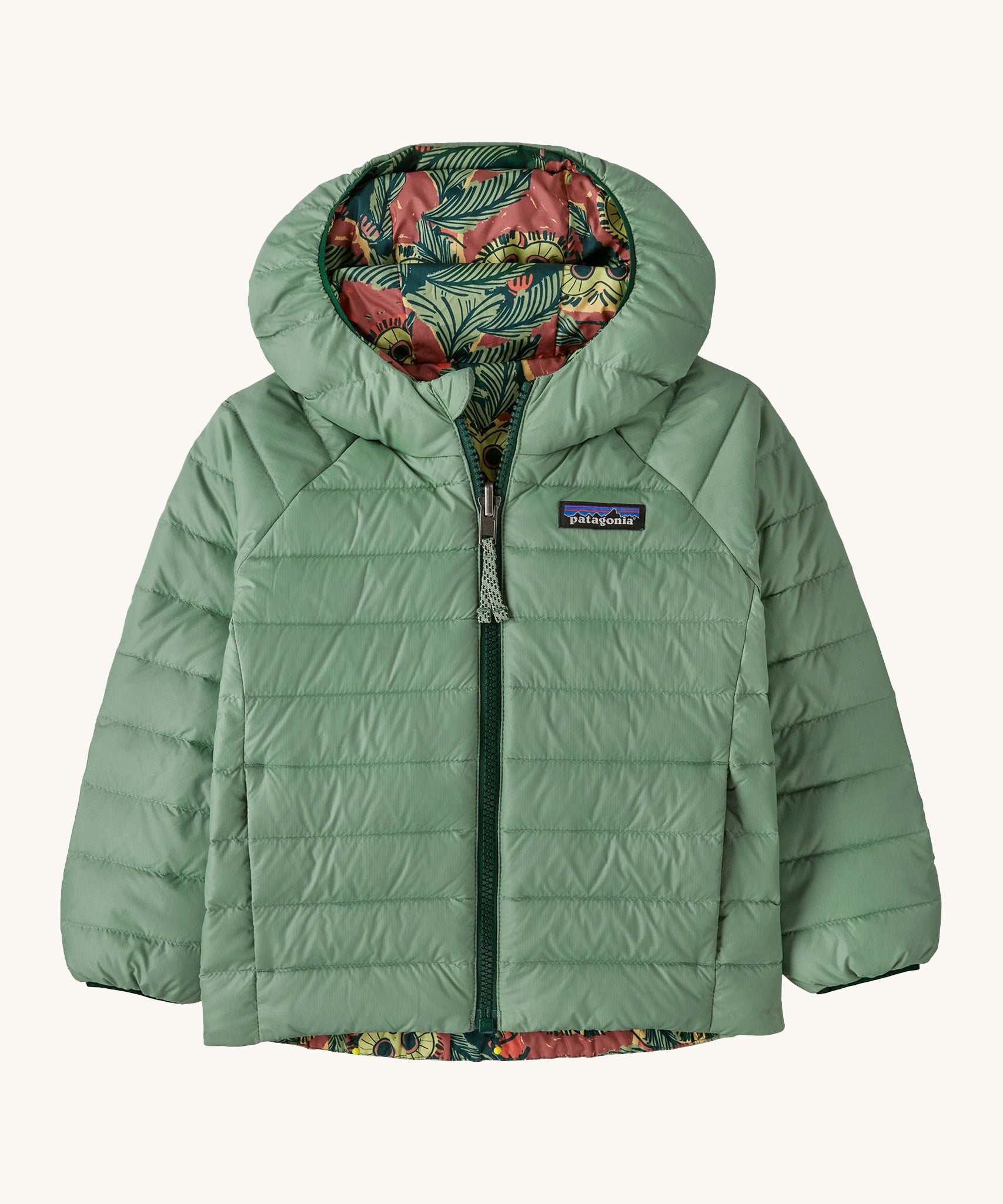 Patagonia little kids down hooded jacket in cascade green/see saw owl. A light green warm reversible jacket with a owl design on the reversible side. Features a a full length zip and 2 side pockets.