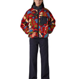 Full view of the Patagonia river river amanita red retro fleece jacket worn by an adult. 