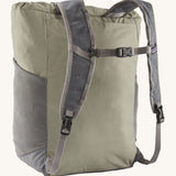 Back view of the Patagonia Terravia tote bag in river rock green colour showing the grey strap detail with buckle for fastening. Features side pockets for holding bottles.