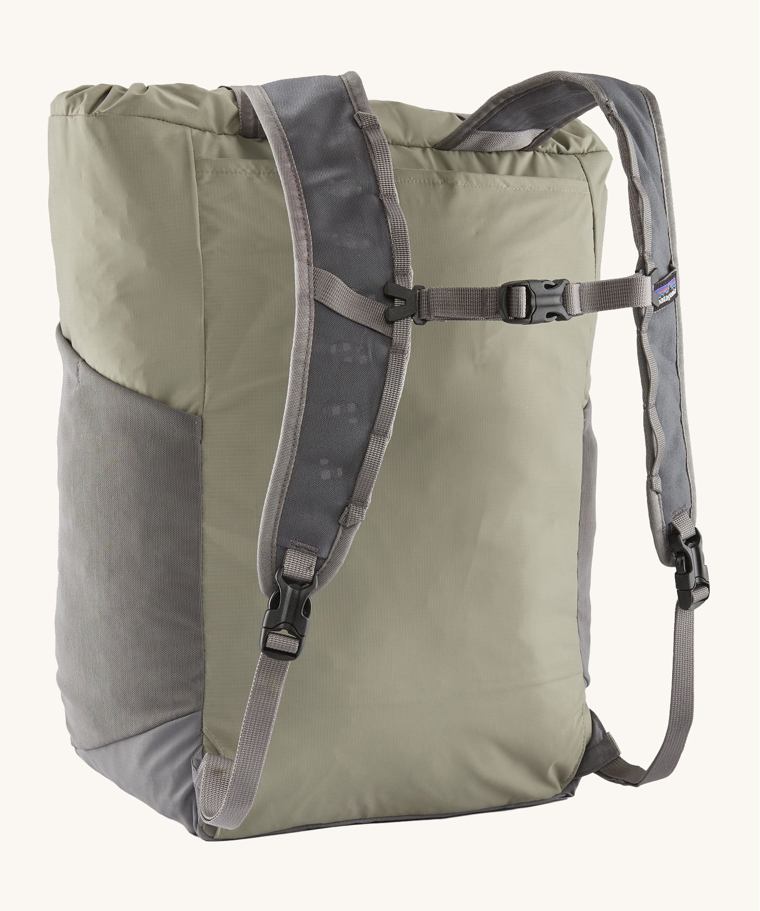 Back view of the Patagonia Terravia tote bag in river rock green colour showing the grey strap detail with buckle for fastening. Features side pockets for holding bottles.