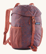 The Patagonia Kids Refugito 12L Backpack   , a dark coral colour backpack with blue patterns all over. Features 2 side mesh pockets and a buckle to close the lid. Logo patch is stitched on the front panel.
