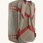 Patagonia 55L duffel bag in a seabird grey colour shoulder strap detail