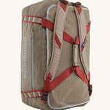 Patagonia 55L duffel bag in a seabird grey colour shoulder strap detail