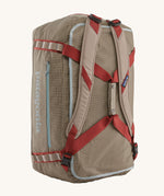 Patagonia 55L duffel bag in a seabird grey colour shoulder strap detail