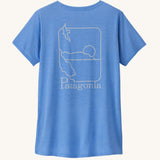 Patagonia women's short sleeve top in light blue beach outline and logo design on a cream background.
