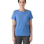 Patagonia women's short sleeve top in light blue beach outline and logo design worn by a woman